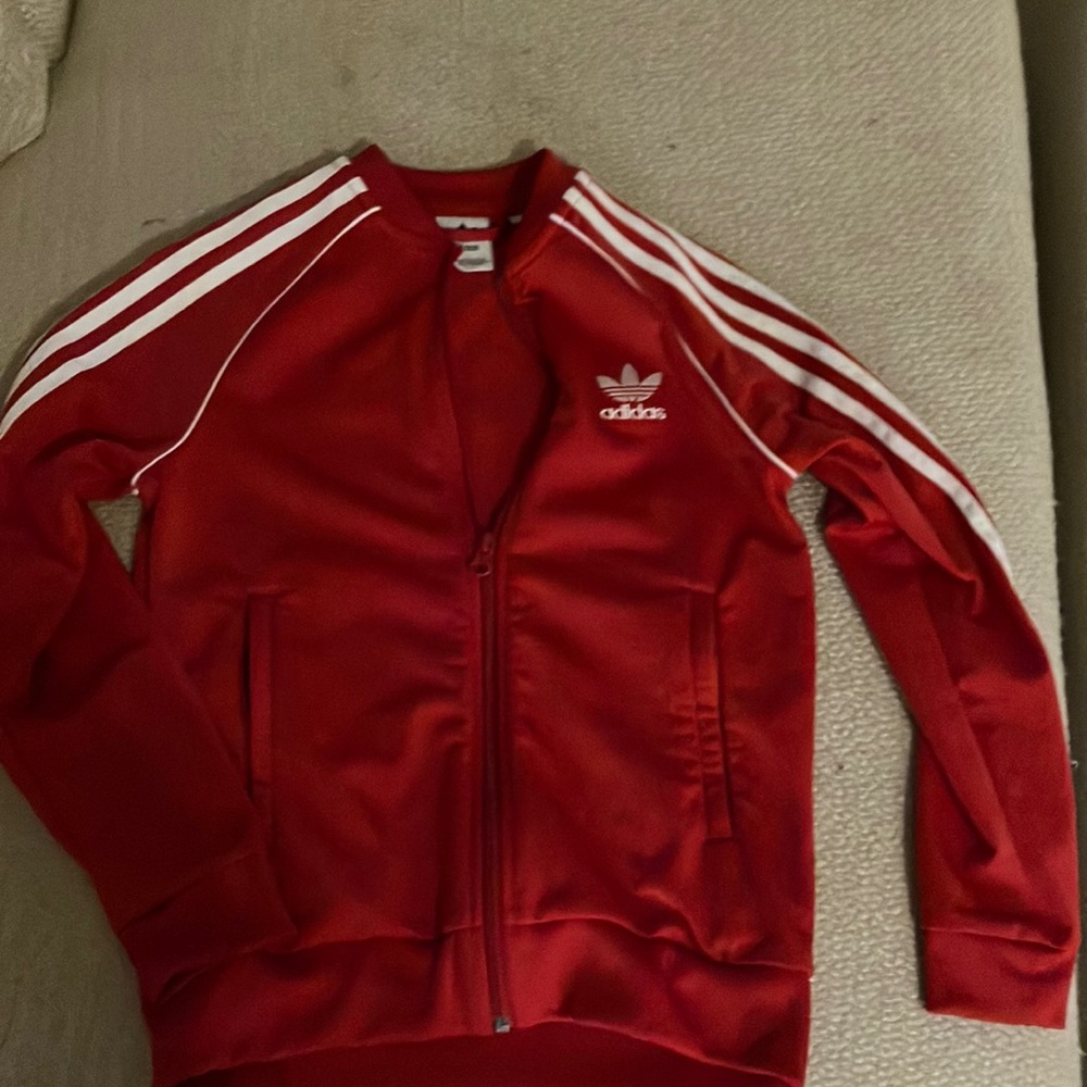A tight adidas’s athletic jacket, great for running and breaks the wind